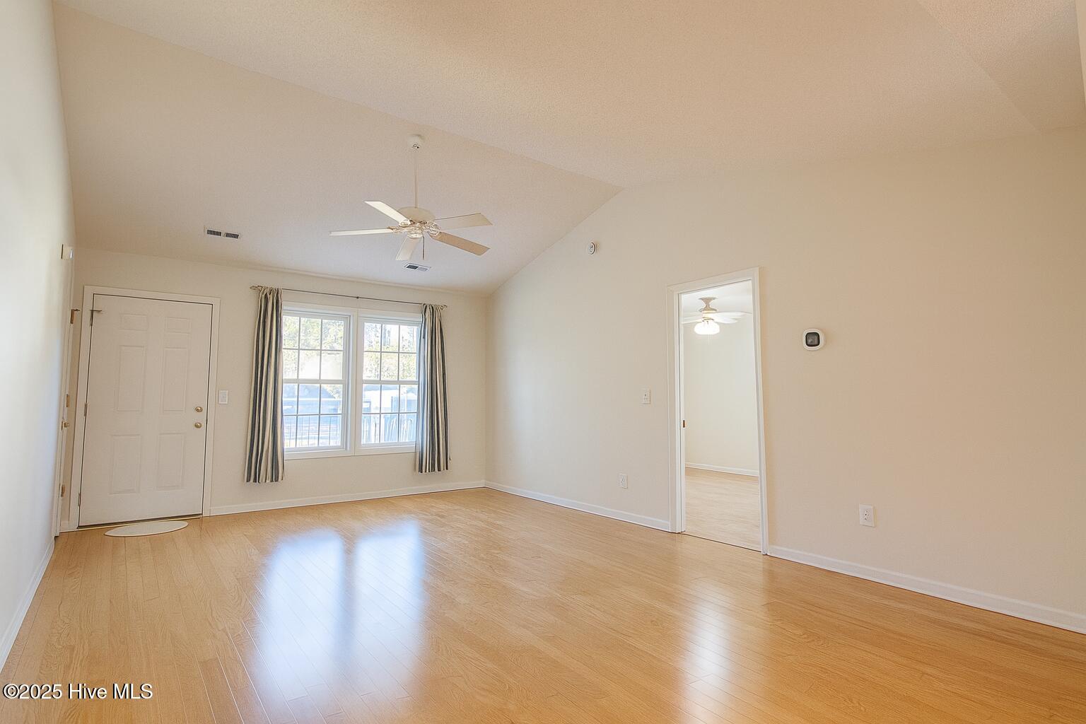 9117 Landing Drive SW, Calabash, NC 28467 – photo 14: Bright Suburban Living Room Interior