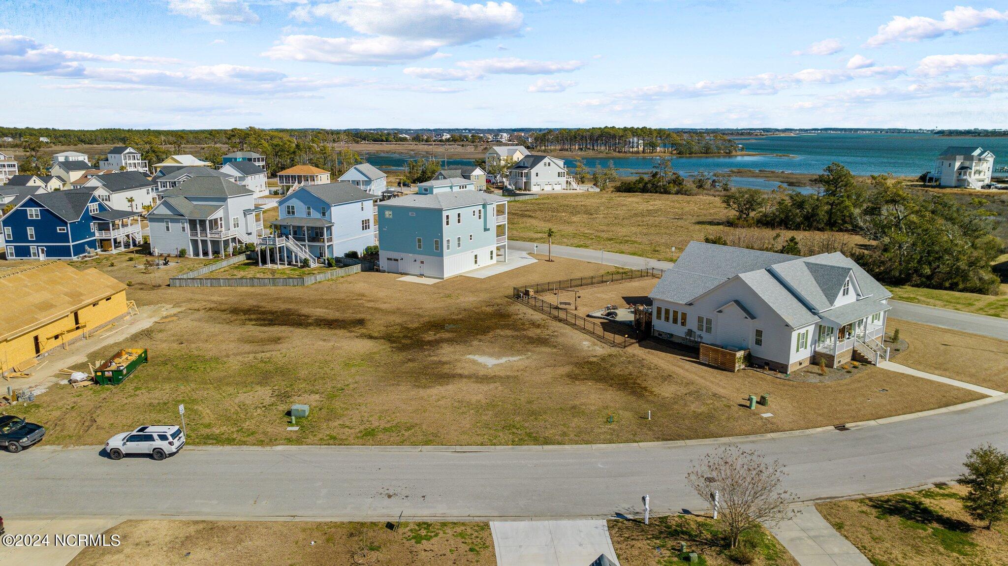 Build up and see that gorgeous water view! 1302 is the lot on the right side of the open space.