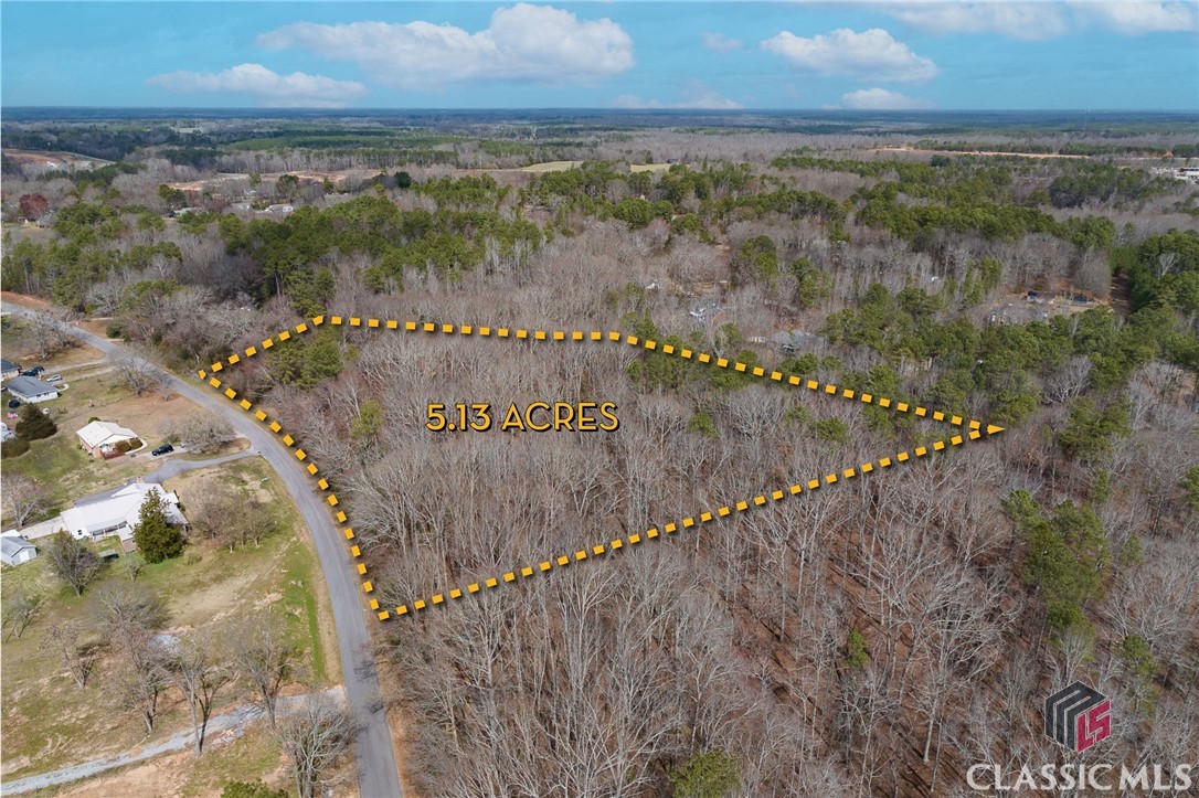 Come explore this wonderful 5-acre lot in Crawford, GA, just a quick 20-minute drive from Athens, GA. It's been recently spruced up to showcase the perfect spot to build your dream home. Surrounded by beautiful hardwood trees, this spacious lot offers plenty of seclusion and tranquility. Plus, it's zoned R-1 (will allow Single-family detached dwellings or individual “Class A” Manufactured Housing) with no HOA limitations. With city water access, more than 450 feet of paved road frontage, and a charming creek nearby, this property has it all.