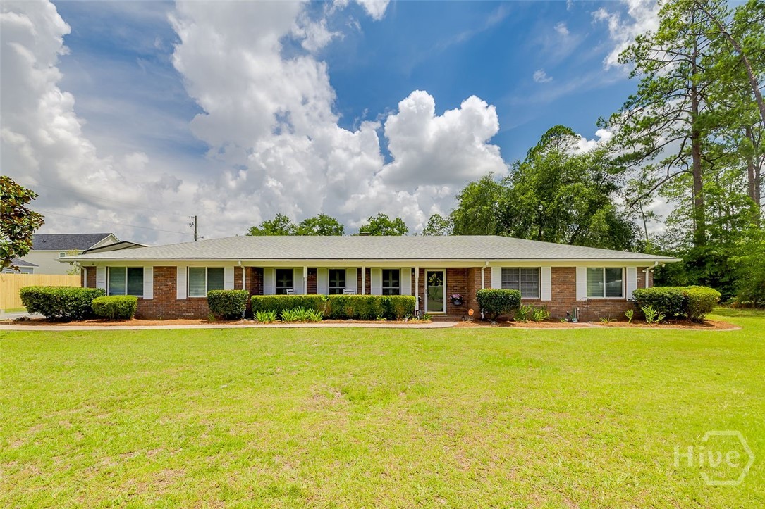 Step into this well-built brick ranch where timeless character and retro-inspired details create a warm, inviting atmosphere. Outside, a magnificent live oak anchors the backyard, while mature blueberry bushes, scuppernong grapevines, pear trees, and fig trees add beauty and the promise of homegrown harvests. For hobbyists, entrepreneurs, or anyone needing extra space, this property truly shines. The impressive **24' x 40' metal garage/workshop** sits on a concrete slab and features power, three bays, and loft storage—everything you need for projects, vehicles, equipment, or recreational toys. Be sure to walk through the attached one-car garage to discover a versatile office space, ideal for a home business or remote work setup. Opportunities like this are becoming increasingly rare. Enjoy the freedom of acreage living—raise chickens, plant a garden, build your dream homestead, or simply unwind beneath the shade of the majestic oak tree. Don't miss your chance to own your own private slice of the countryside.
