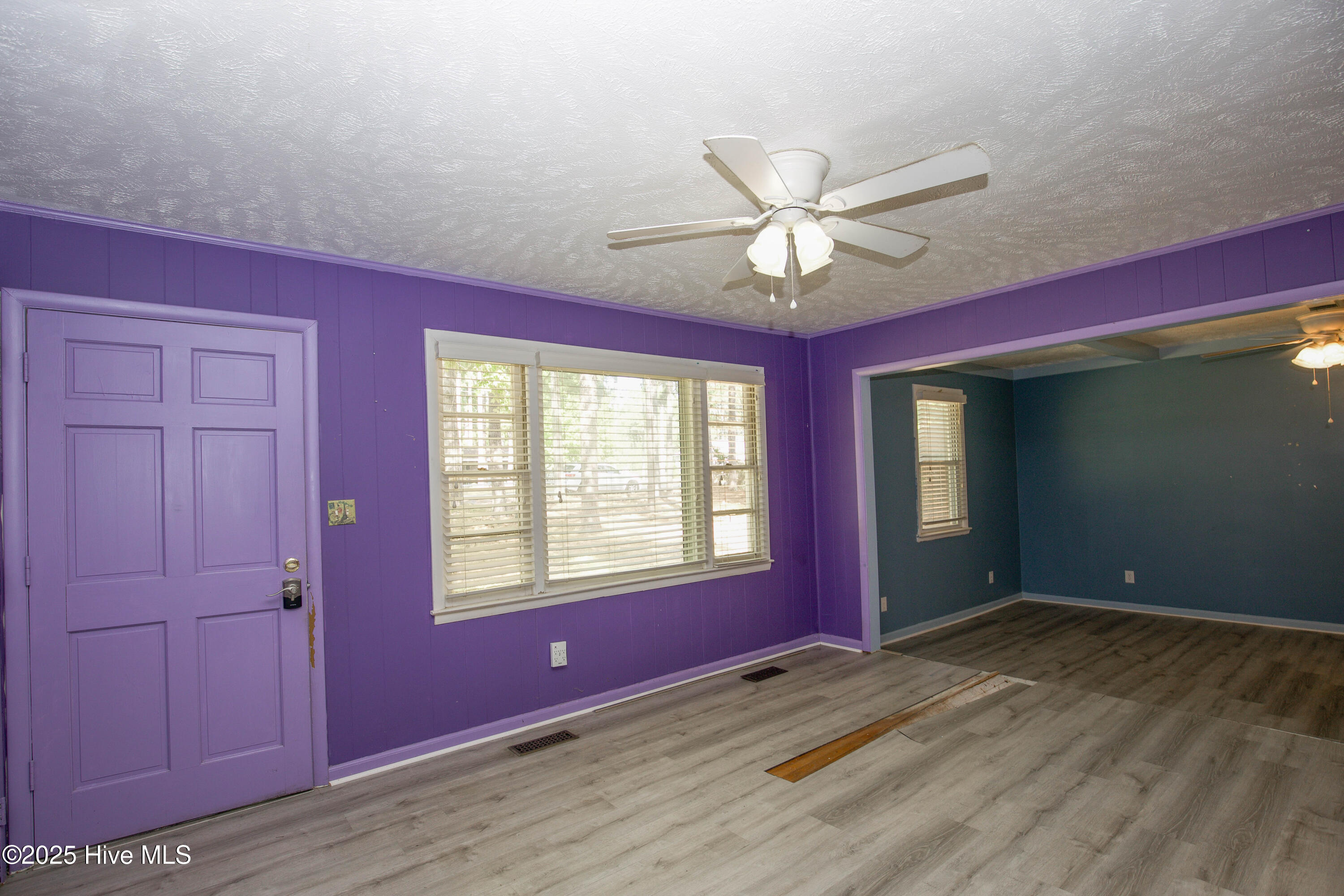 LivingRoomAngledToFamilyRoomAndFrontDoor