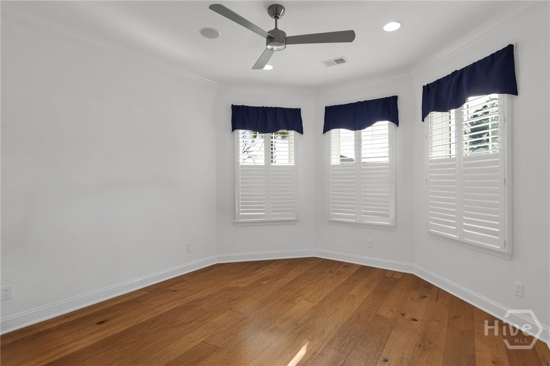 Included Features - Music speakers in the ceiling, wood flooring and bay windows with plantation shutters overlooking the front yard