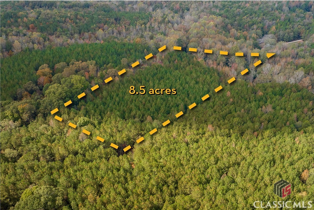 Step away from the city and bring your dream home to life on this 8.5-acre scenic South Jackson County property. The land slopes gently toward a creek and levels out, providing scenic creek and pond access unique to this property. With wooded pines offering a natural privacy screen, this parcel is ideal for those seeking a quiet retreat. Located off a gravel road with underground power and a transformer already in place, it’s a blend of tranquility and convenience just a short drive from Highway 129 and Athens. See plat in photos and imagine your future in this serene setting.