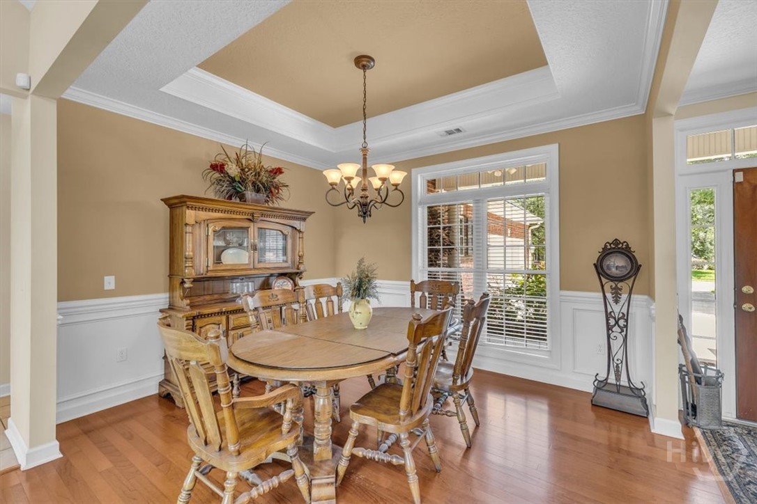 Charming Dining Area with a trey ceiling and crown