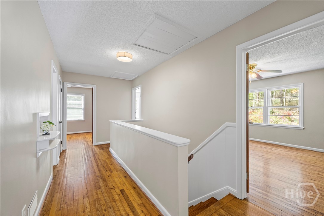 Upstairs Hallway and Primary Bedroom view, #3 & #4 Bedroom Entries