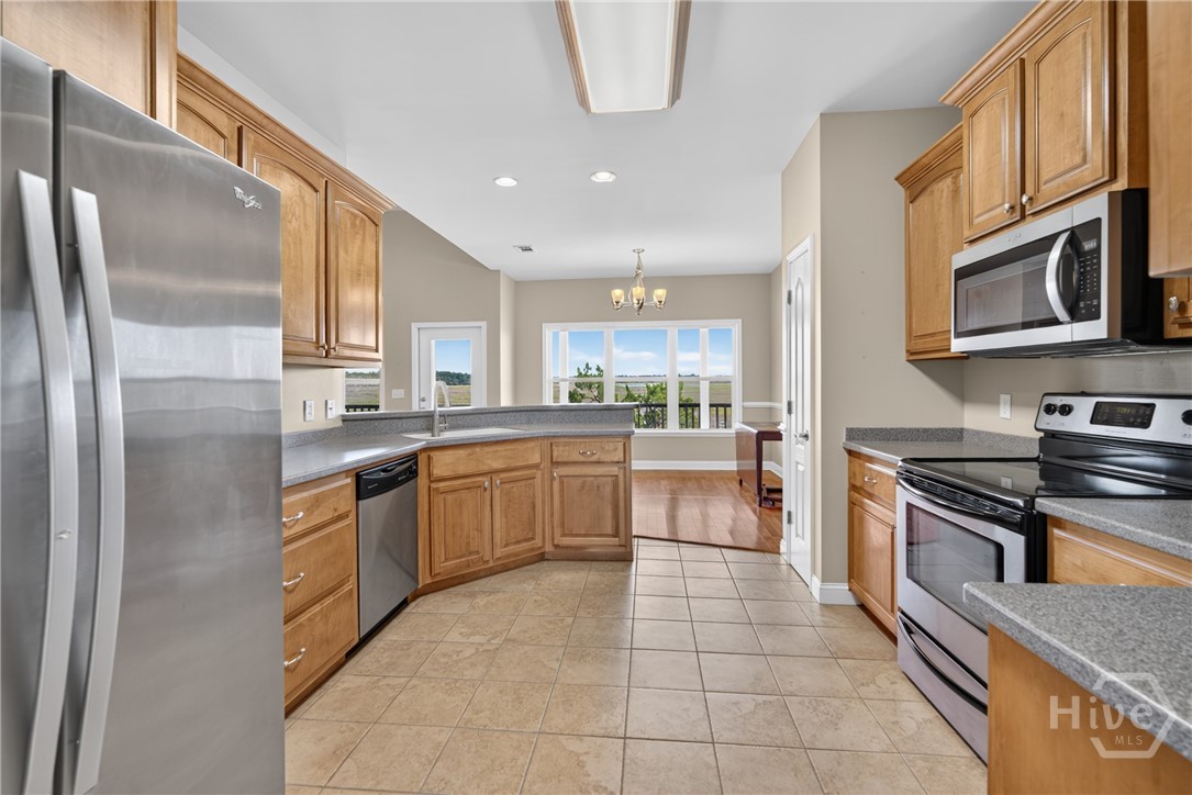 Kitchen with custom, locally made maple cabinets that are classic and stand the test of time. All appliances stay!