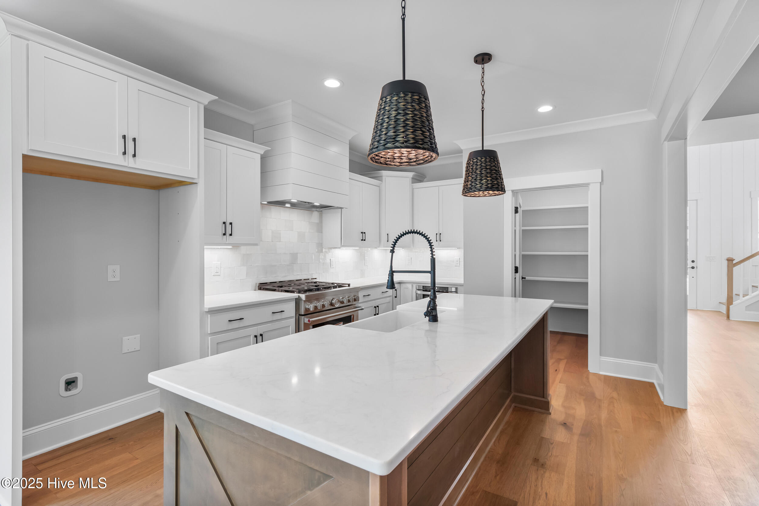 Open kitchen with large island, sink and extra seating