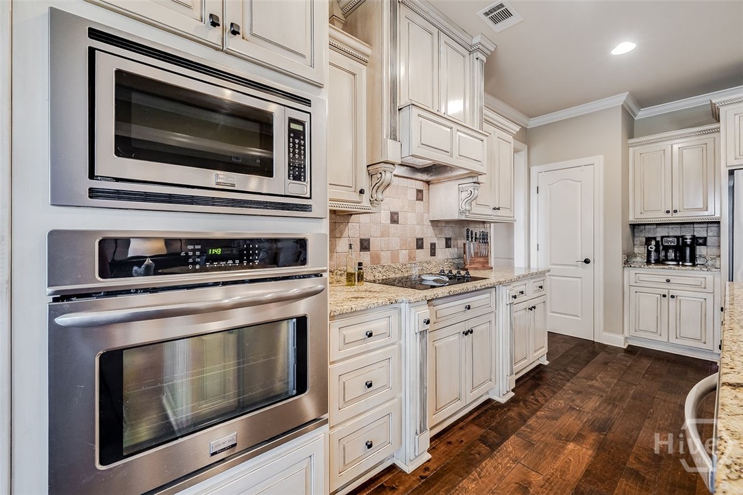 Spice racks on both sides of the stove that pull out for easy access. A sellers favorite discovery when they moved into the home