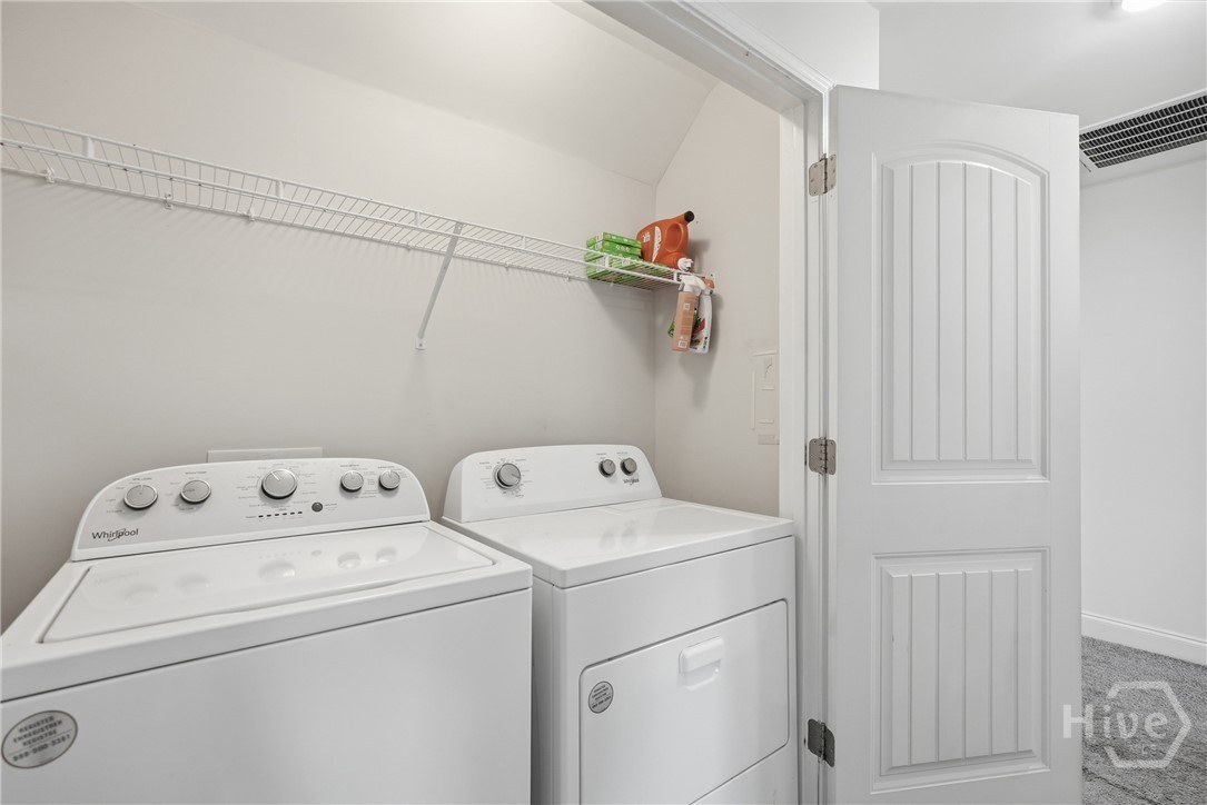 Laundry closet is conveniently located in the second floor hallway.