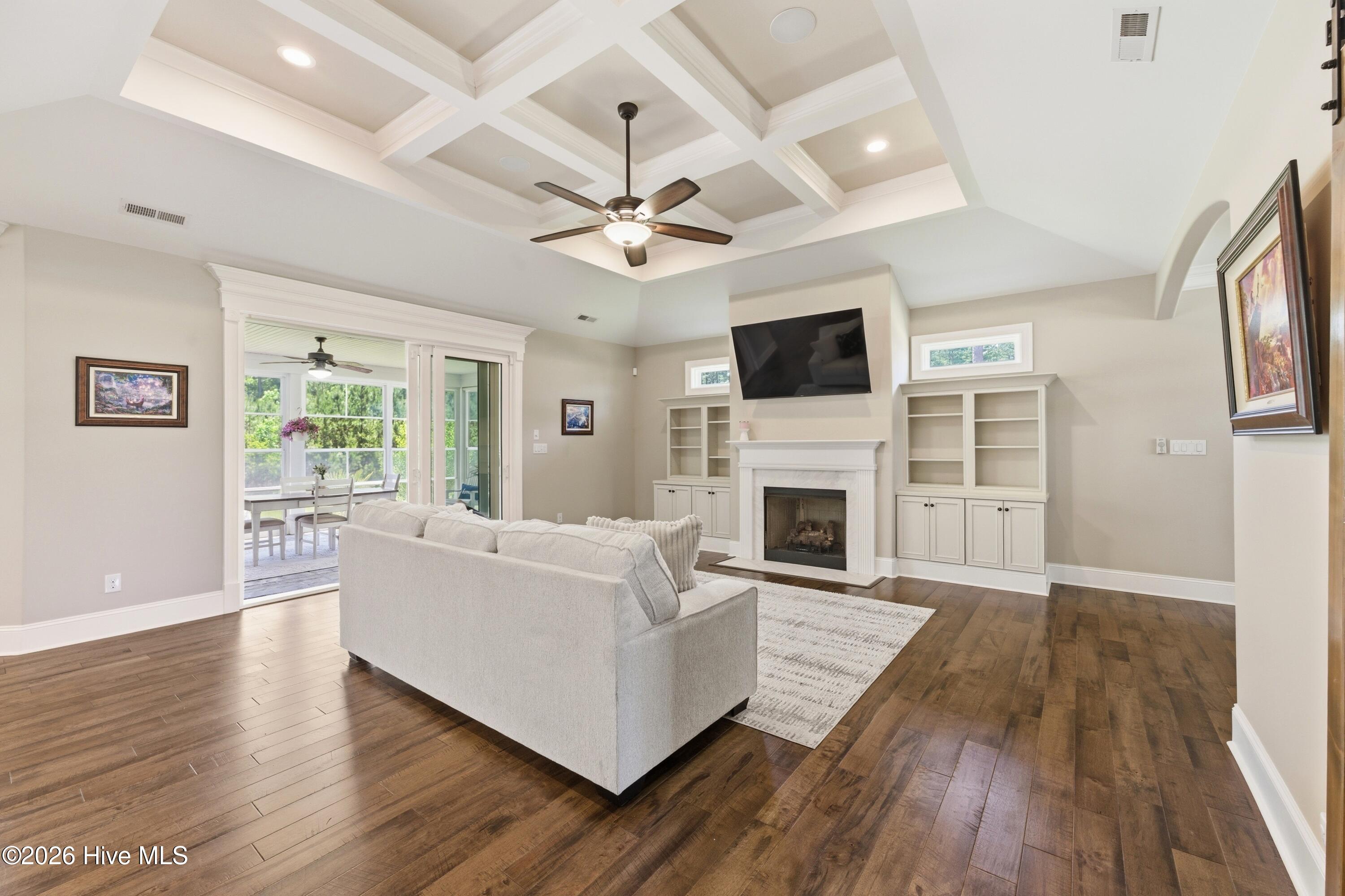 living room overlooking screened in porch