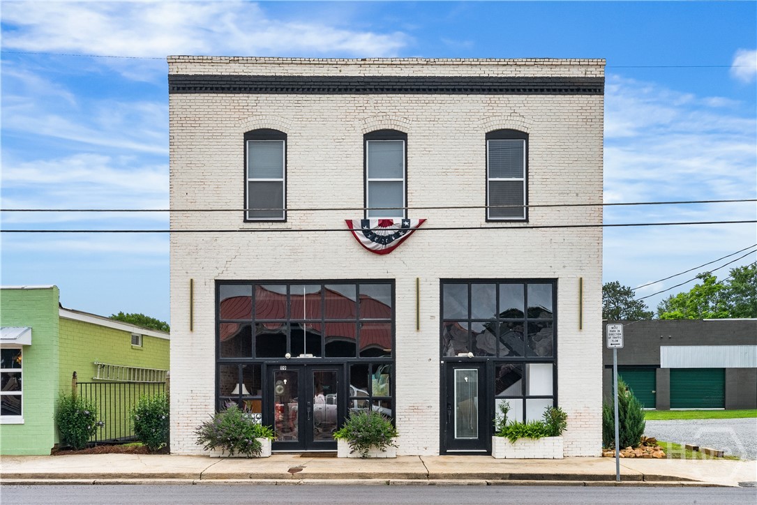 Retail on Bottom, Two Rental Units on Top Floor