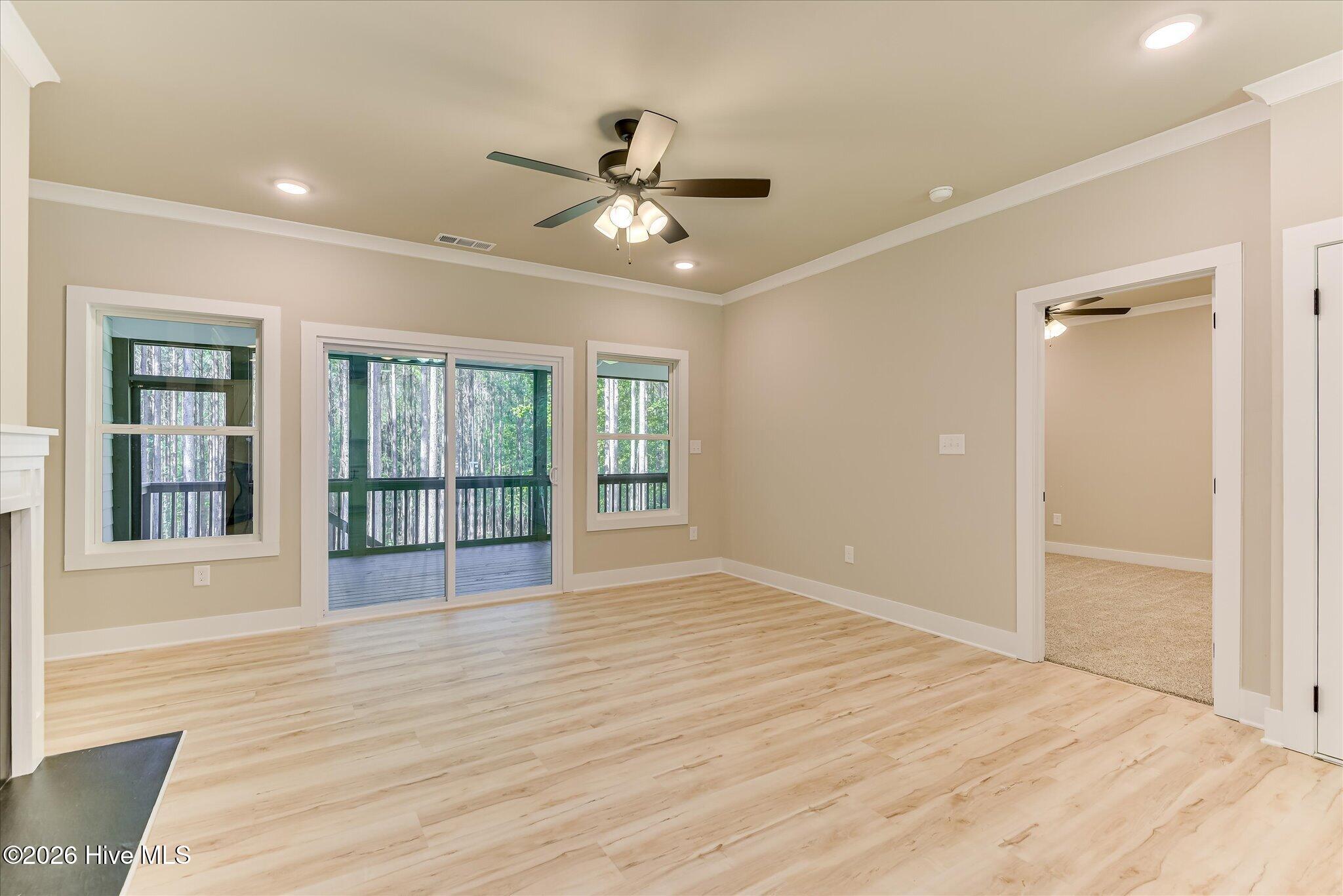 Sliding doors to rear screened porch, door to Primary bedroom