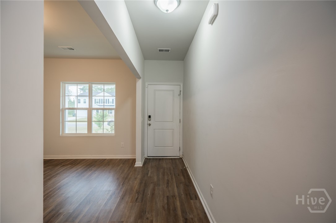 Entry hallway with view of dining room
