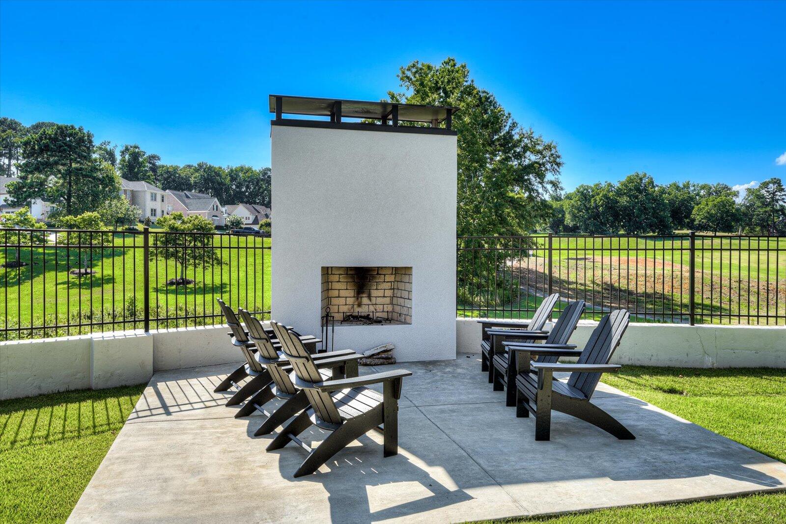 Outside Fireplace-Separate wood burning fireplace. Concrete setting area.