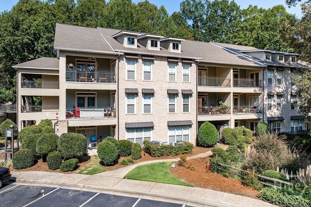 Step into Unit 207 at The Flats of Woodlake and catch a whisper of the English countryside—fresh, bright, and perched above a pond where the lilies bloom and fireflies still dare. This rare, single-level 3BR/2BA ranch-style condo in Athens offers 1,680 sq ft of graceful living: vaulted ceilings, hardwood floors, and a gas fireplace that actually behaves. The kitchen’s crisp white cabinetry, granite counters, and stainless appliances make it both charming and functional—yes, you can braise and bake at the same time. French doors lead to a private balcony with pond views. The primary suite? Calm, quiet, and cut off just enough to make sleeping in feel like a skill. Plush carpet, new finishes, and a spa-like bath that doesn’t need a filter. Two more bedrooms flex for guests or your home office. Gated community includes trails, a pool, and lake views. Close to everything, but lives like it’s worlds away. Not just a condo—this one’s a lifestyle with a floorplan that doesn’t play games.