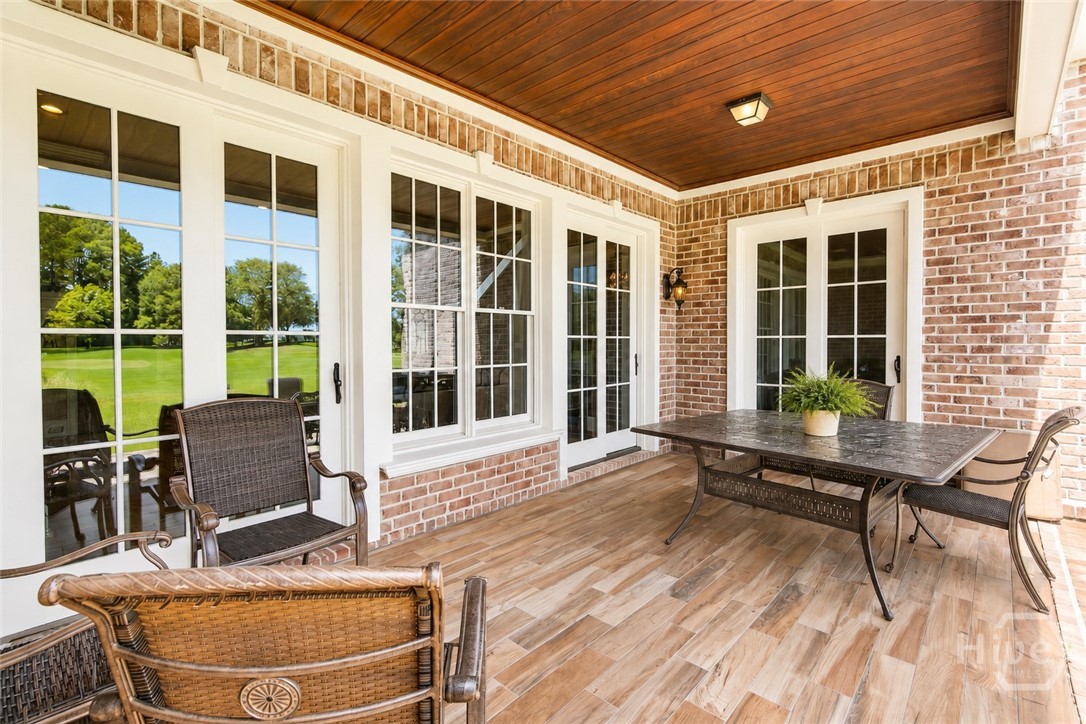 First floor covered patio off family room and den