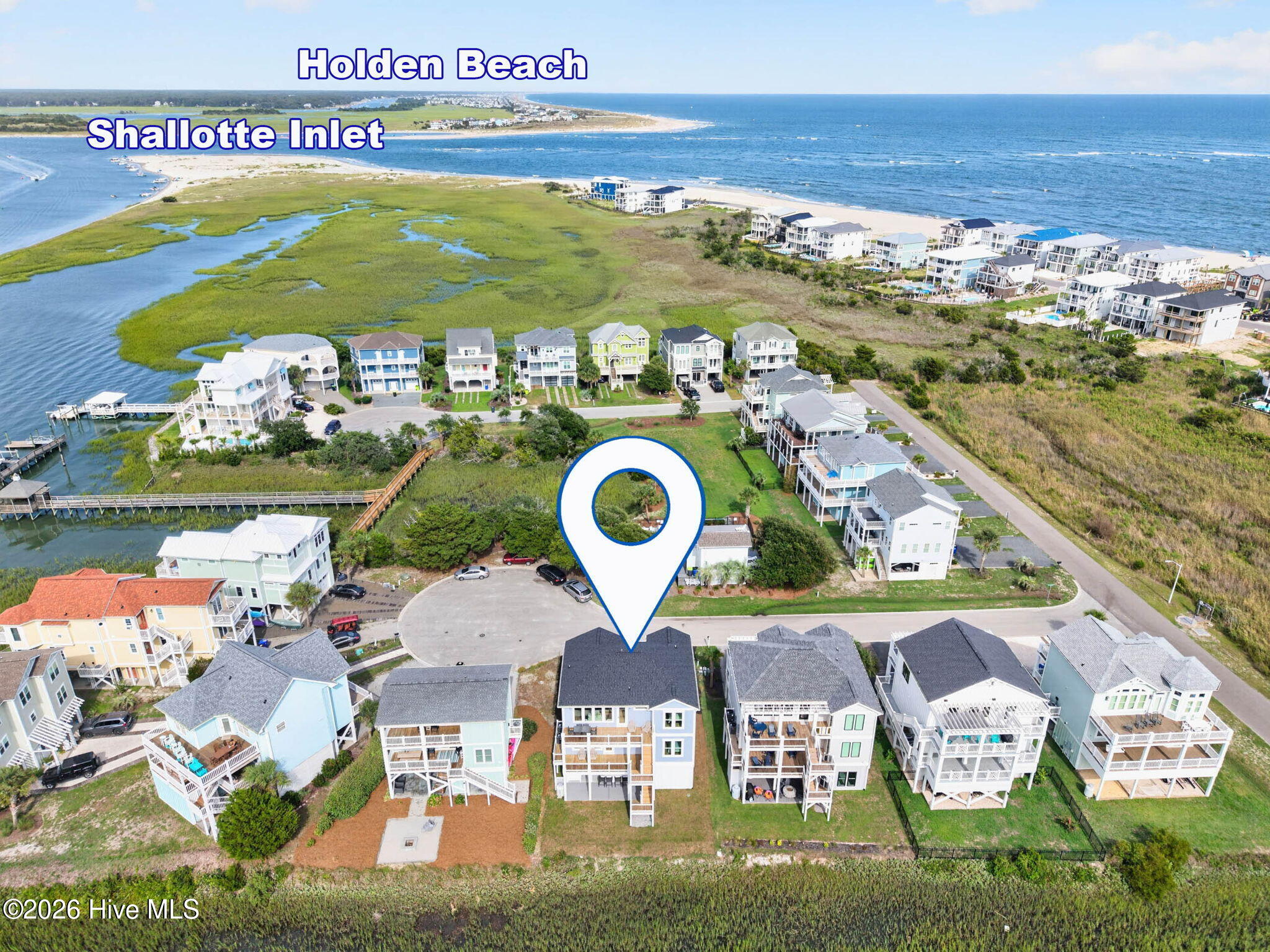 Elevated aerial perspective capturing the surrounding marshes, waterways, and coastal neighborhood of Maritime Place.