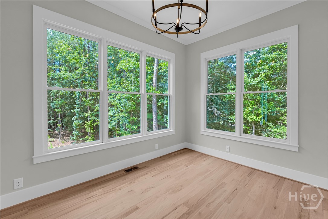 Stunning chef’s kitchen featuring marble and quartz countertops, a complete Thermador stainless steel appliance package, 5-burner natural gas cooktop, dedicated coffee station, and an impressive butler’s pantry for added storage and entertaining convenience