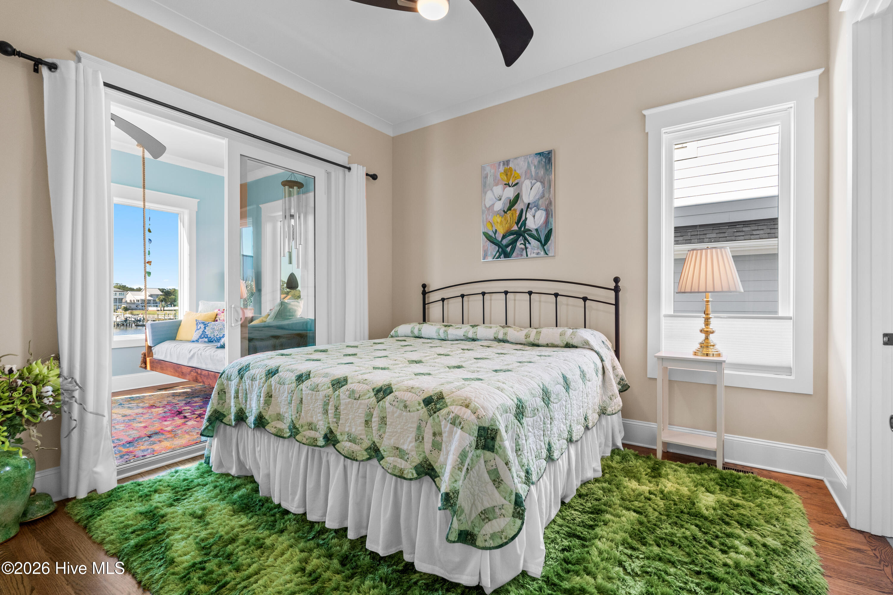 King size bed easily fits in the bedroom with direct access to the Carolina room