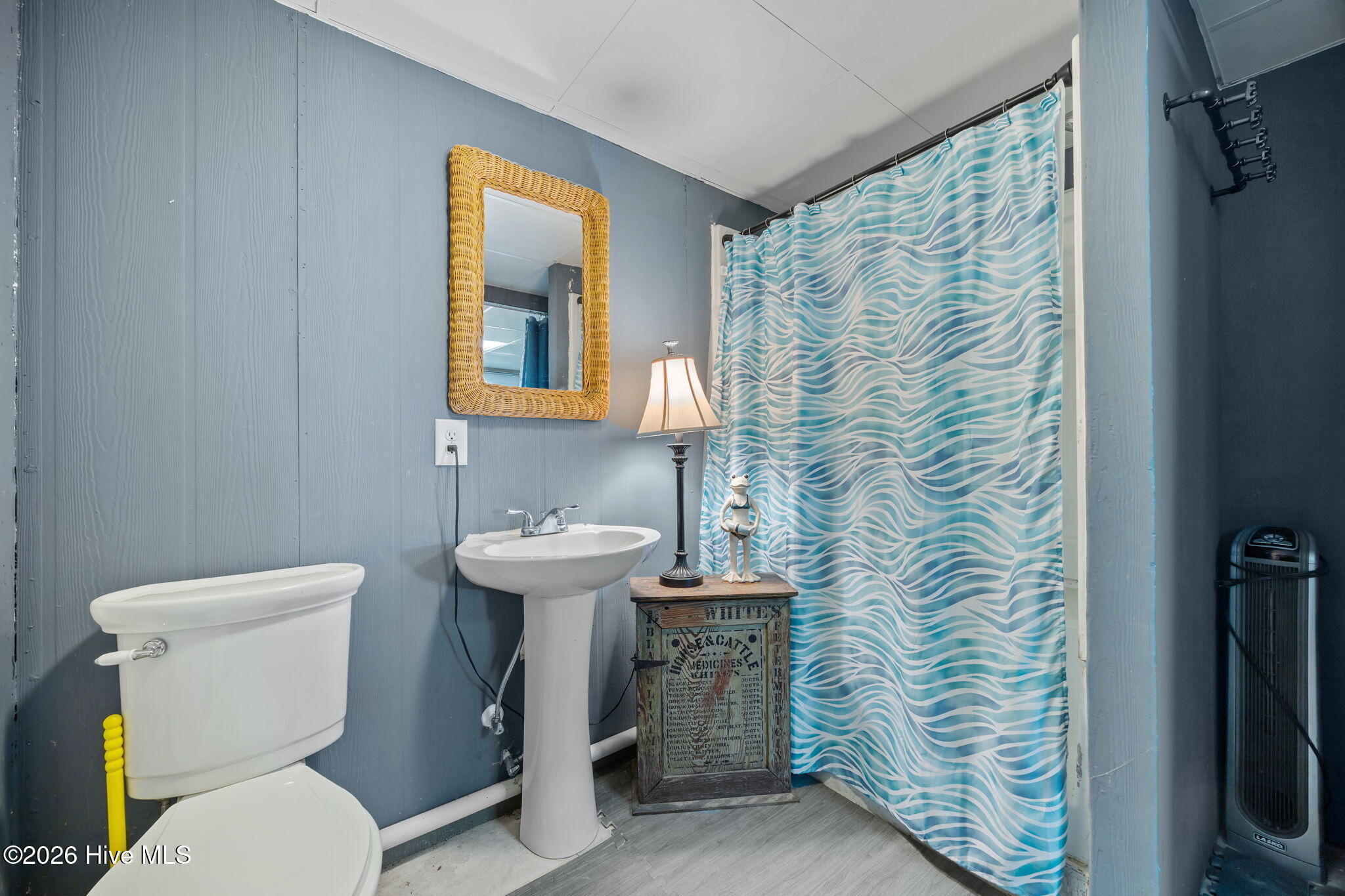 full bathroom with walk-in shower on lower level