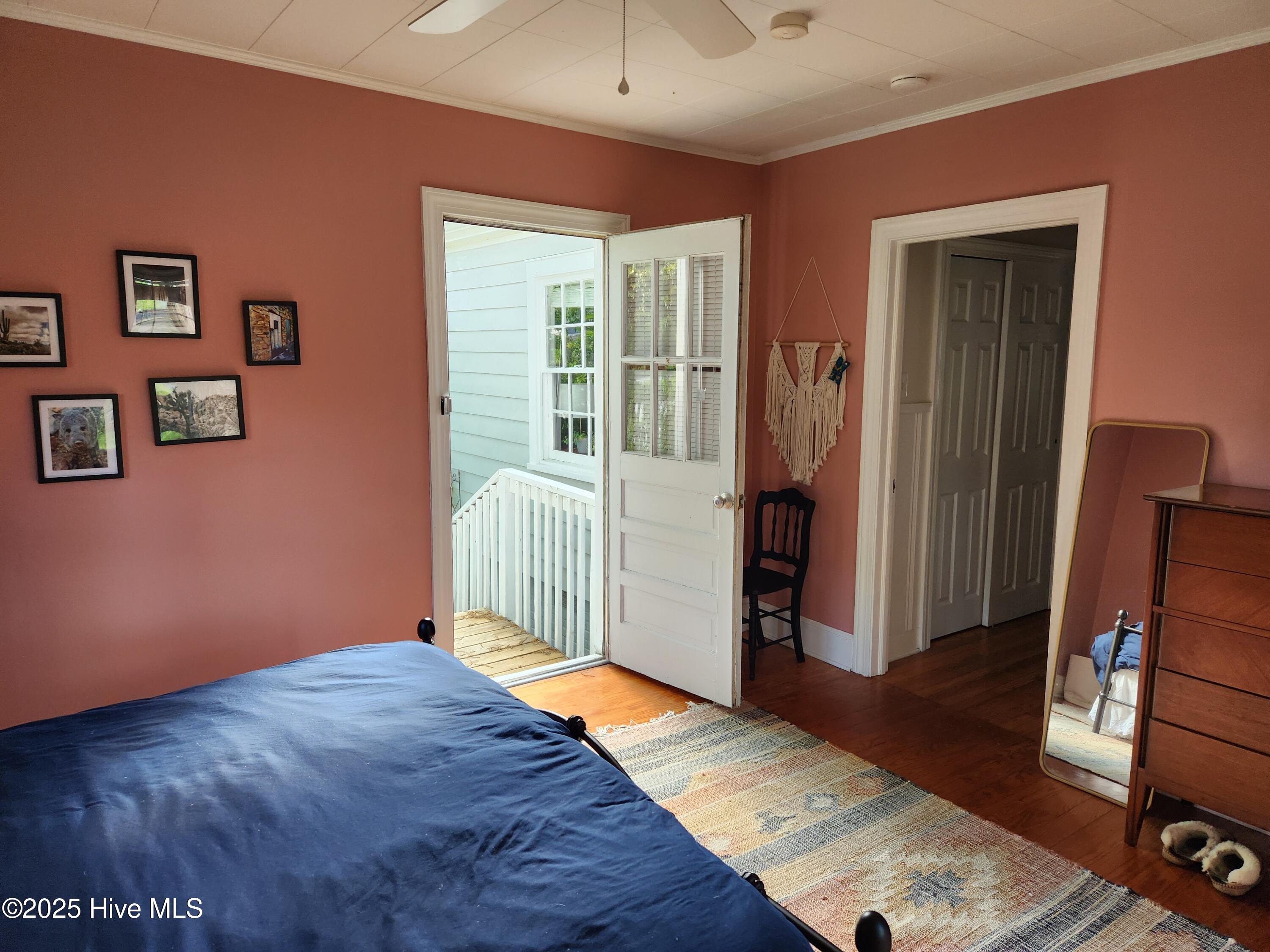 Primary Bedroom w/ door to exterior exit.