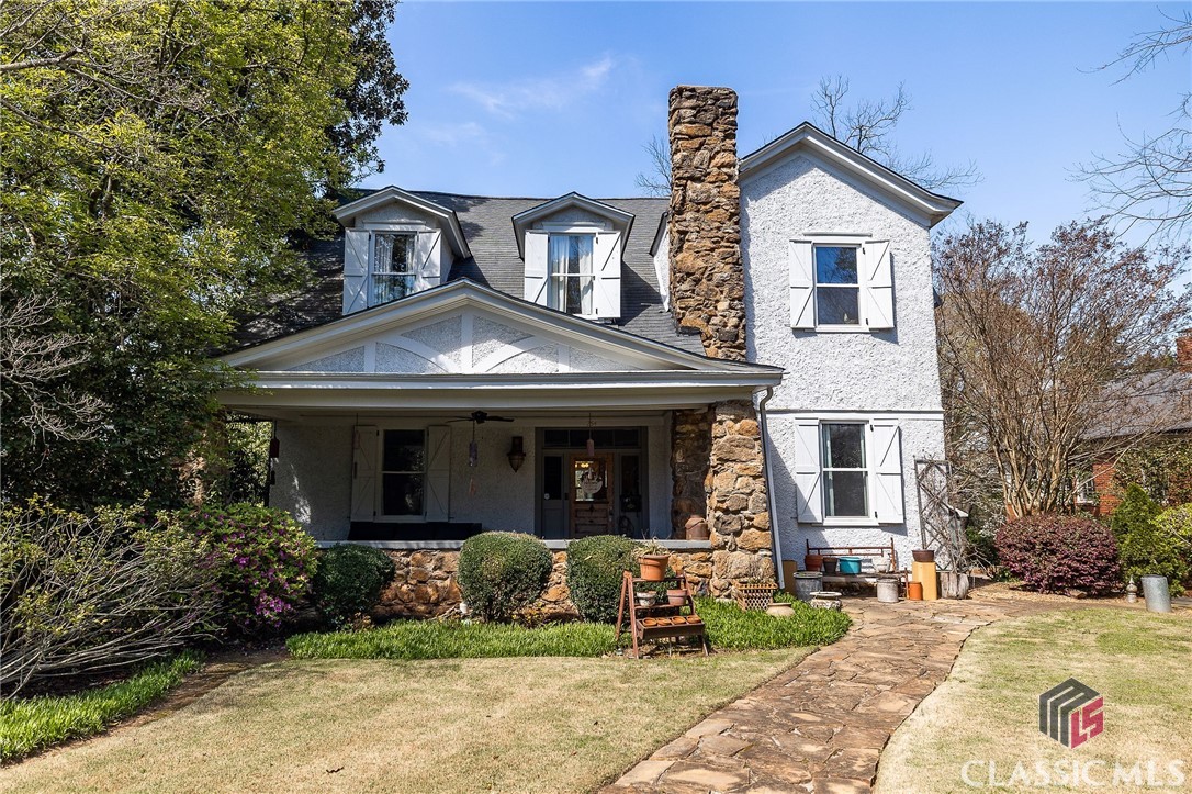 “Historic Dearing Street has an aura—quintessentially Southern, intimate, tranquil, and downright alluring . . . Dearing Street remains the essence of neighborhood and charm [with an] inescapable, unexplainable air of hospitality mixed with a reverence for nature.”—Frances Taliaferro Thomas, Historic Dearing Street Welcome to the Goodwin-McNeil home built circa 1908-1913, nestled on shady Dearing Street and overlooking a downtown corridor. This two story, craftsman bungalow tells of modern conveniences with artfully preserved timeless character. You’ll be greeted by the perfect place to unwind, the grand front porch. As you step inside, a spacious central hallway leads to the main living room at the back of the home, privately located and with access to a partially covered trex deck. Discover a haven of relaxation in the primary suite on the main floor, boasting a refreshingly modern bathroom. The renovated kitchen has ample pantry space, stylish bar-style seating, and stainless appliances. Formal dining, living, and a laundry room are also on the first floor. Ascend the grand staircase and discover a light-filled sunroom calling to be matched with a splendid outdoor deck. Venture into a secluded office that can effortlessly convert into a cozy bedroom, complete with a closet. Unwind in a luxurious full bathroom, conveniently accessible from both the sunroom and hallway. Appreciate ample space on the landing area, just waiting to be transformed into an extra living or work area. Finally, explore three generously-sized bedrooms, each a sanctuary of comfort and style. The garage addition is designed to accommodate even the most colossal of trucks and topped off with abundant storage for all your treasures! And it doesn't end there - ascend into a cozy 450 sq ft studio retreat, where warm summers and cool winters are but a distant memory. This hidden gem even boasts the foundations of a kitchen, with conveniently accessible electrical wiring, just waiting for your creative finishing touches. Discover your dream spot in Athens—a unique Athens treasure in an unparalleled location steeped in history.
