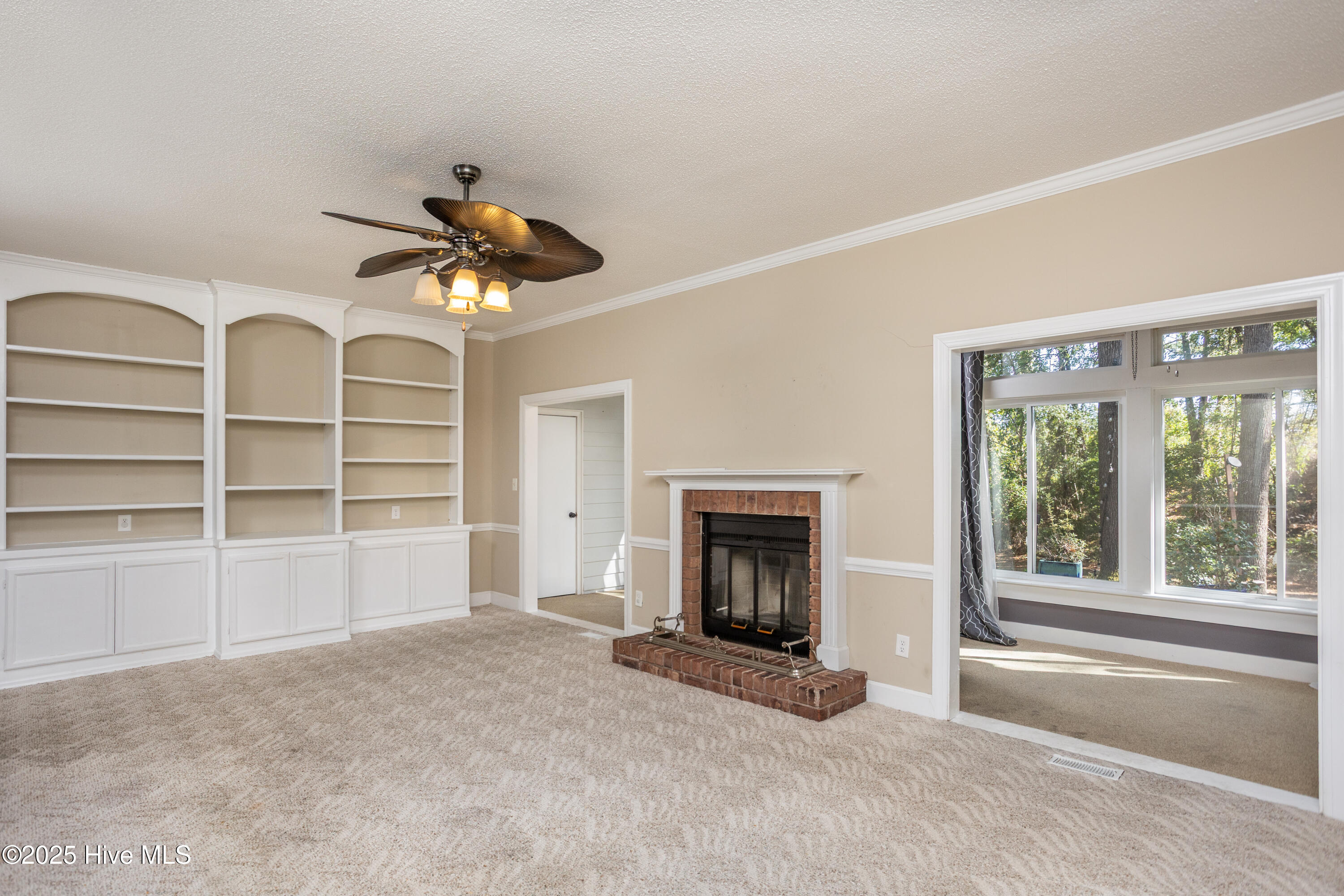 Living Room with fireplace and bookshelves