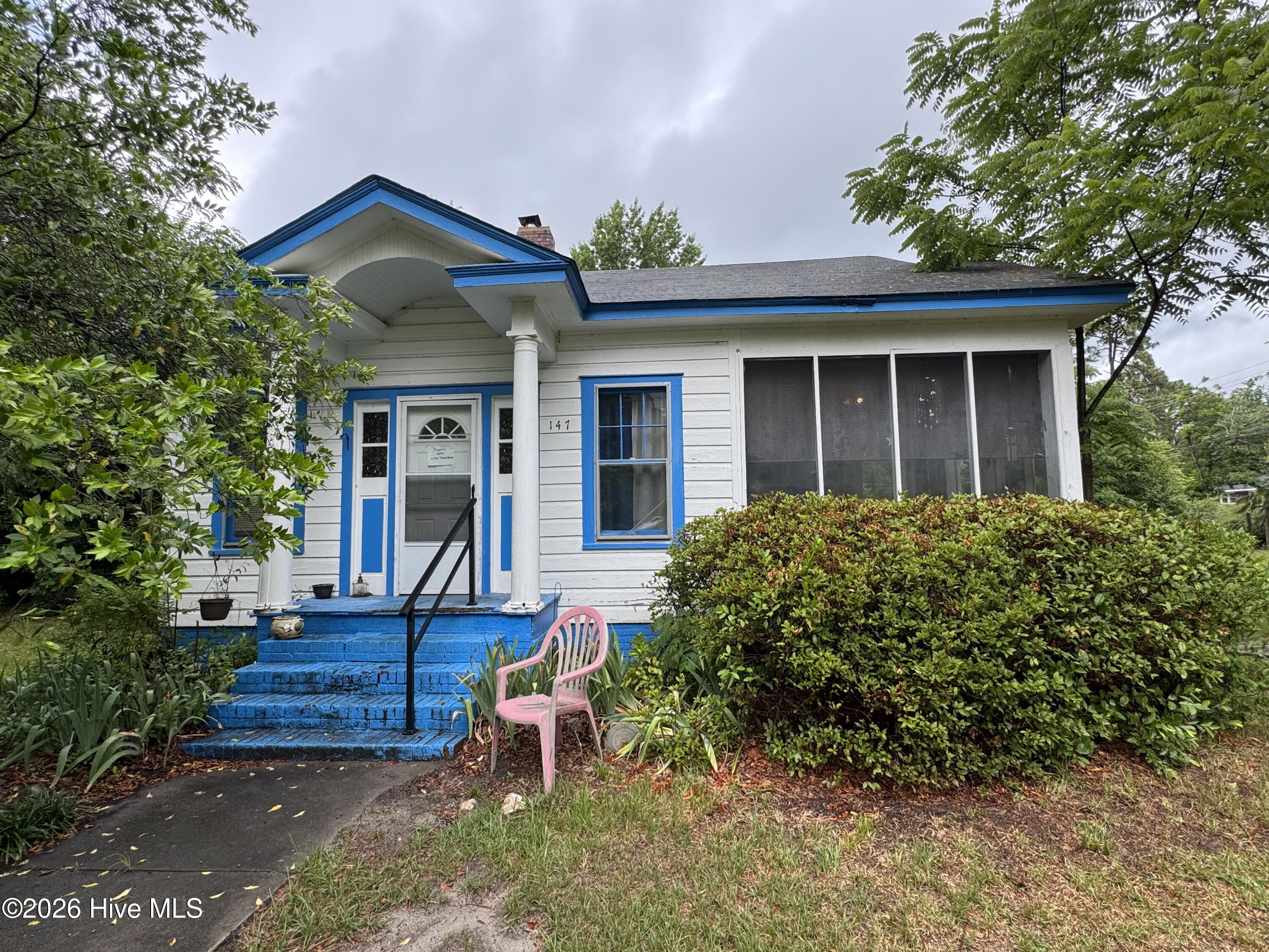 Investment property with tons of character and potential! 3 Bedrooms and 1 bath with a large family room, dining room, side porch, and almost an acre on two parcels!