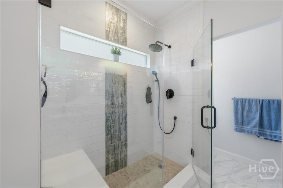 Upgraded shower with frameless glass.