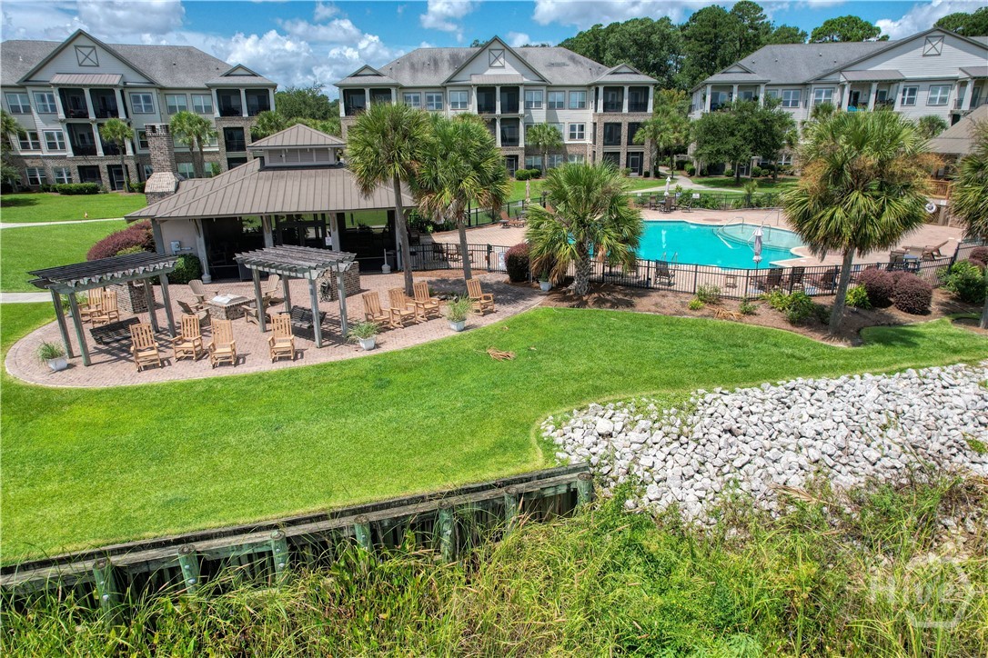 Grilling area, the outdoor clubhouse, and the pool are waiting for the party to start.
