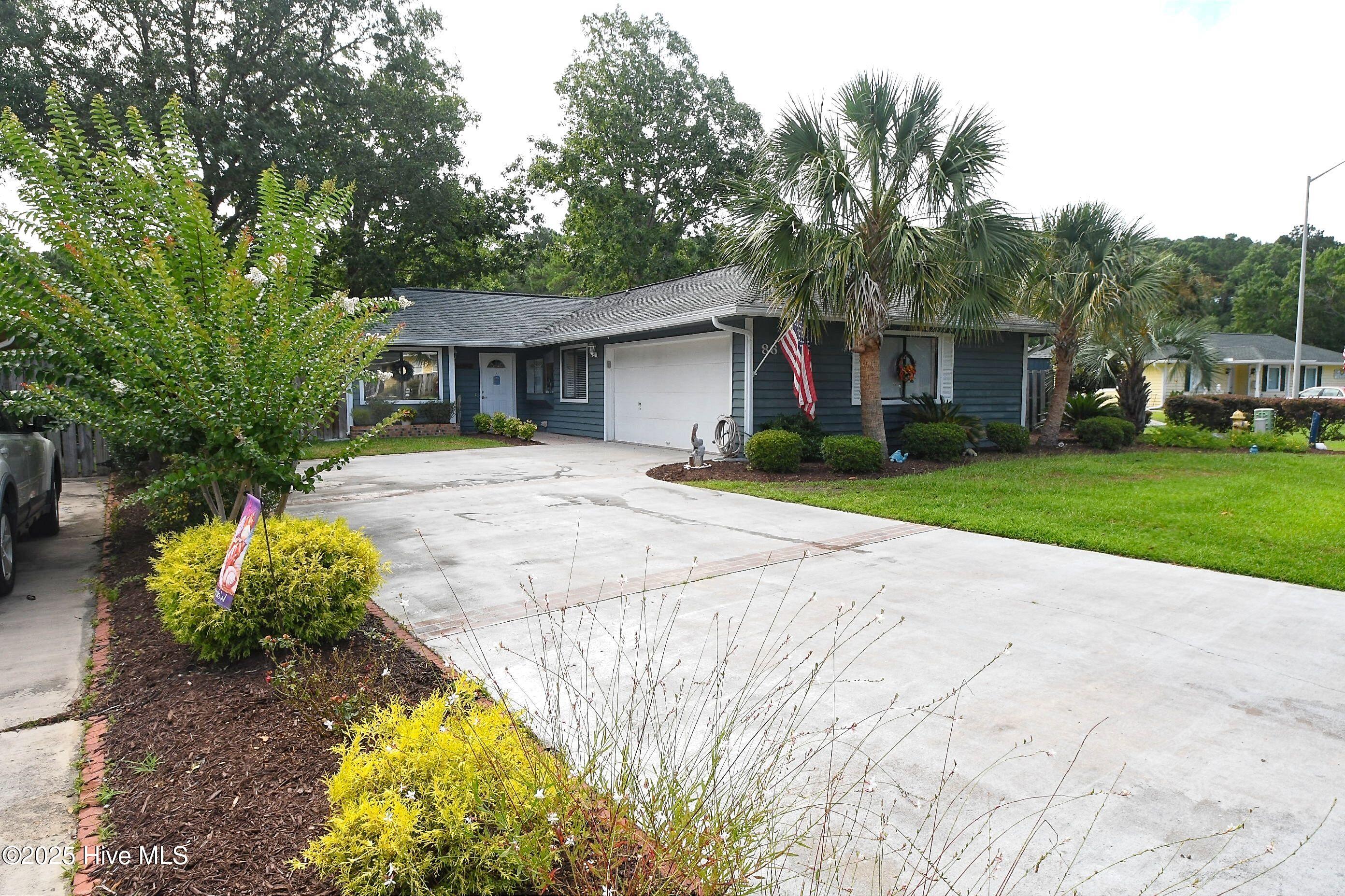 86 Cedar Tree Lane SW, Calabash, NC 28467 – photo 2: 2-car Garage