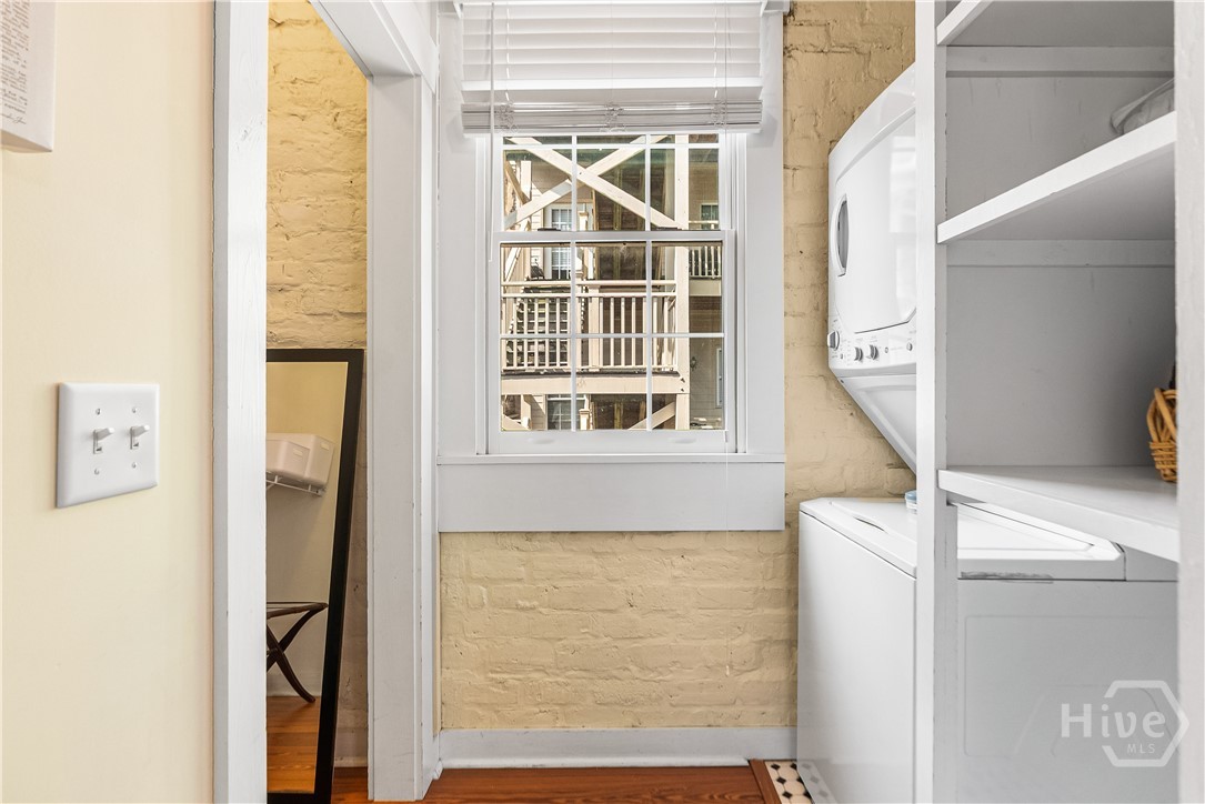 Laundry area with stackable washer and dryer.