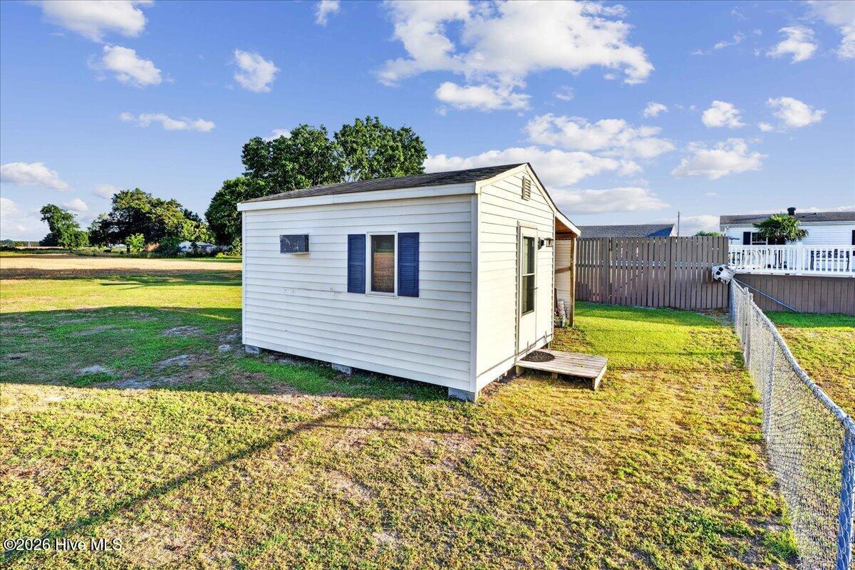 Located in the backyard. Hobby space, office, exercise room, AC window unit.