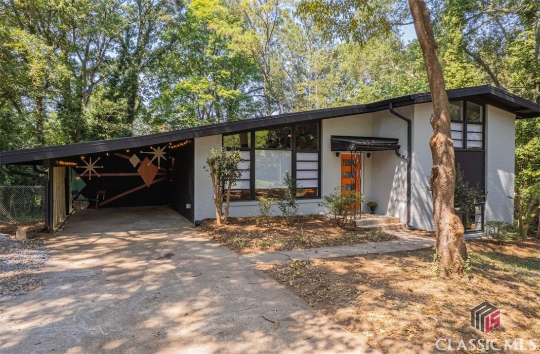 Sold before published. Completely updated Midcentury Modern tri-level home close to Normaltown. New metal roof, HVAC, electrical, water heater. Open living concept includes updated kitchen with stainless appliances, quartz countertops, new cabinetry. Hardwood flooring throughout. Sold fully furnished.