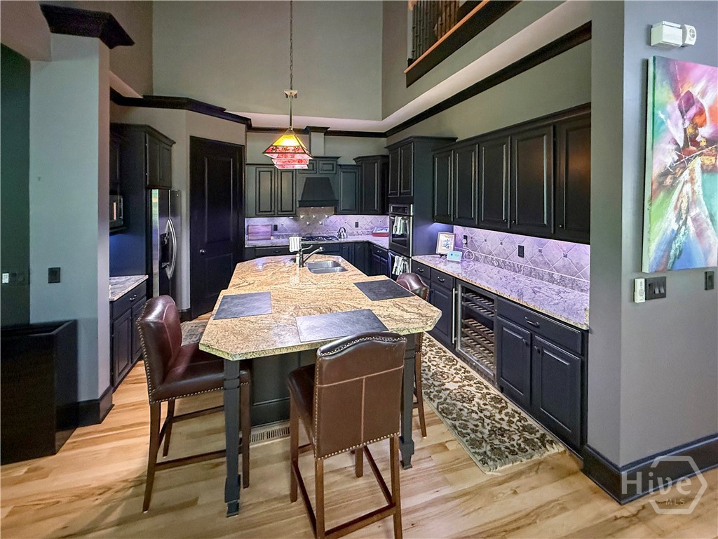 Gourmet Kitchen with large island with bar stools