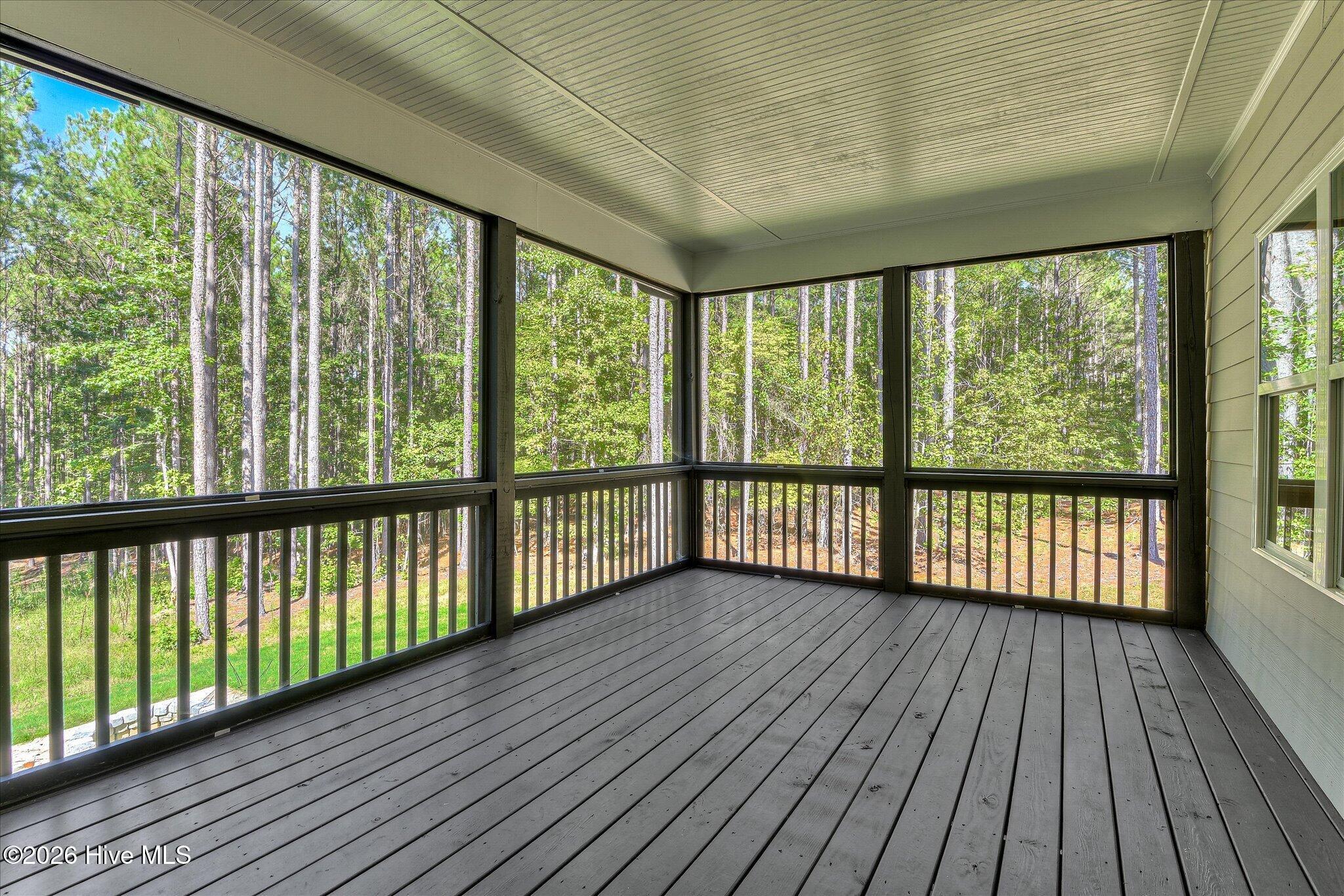 Screened porch stretches across the back of the home.