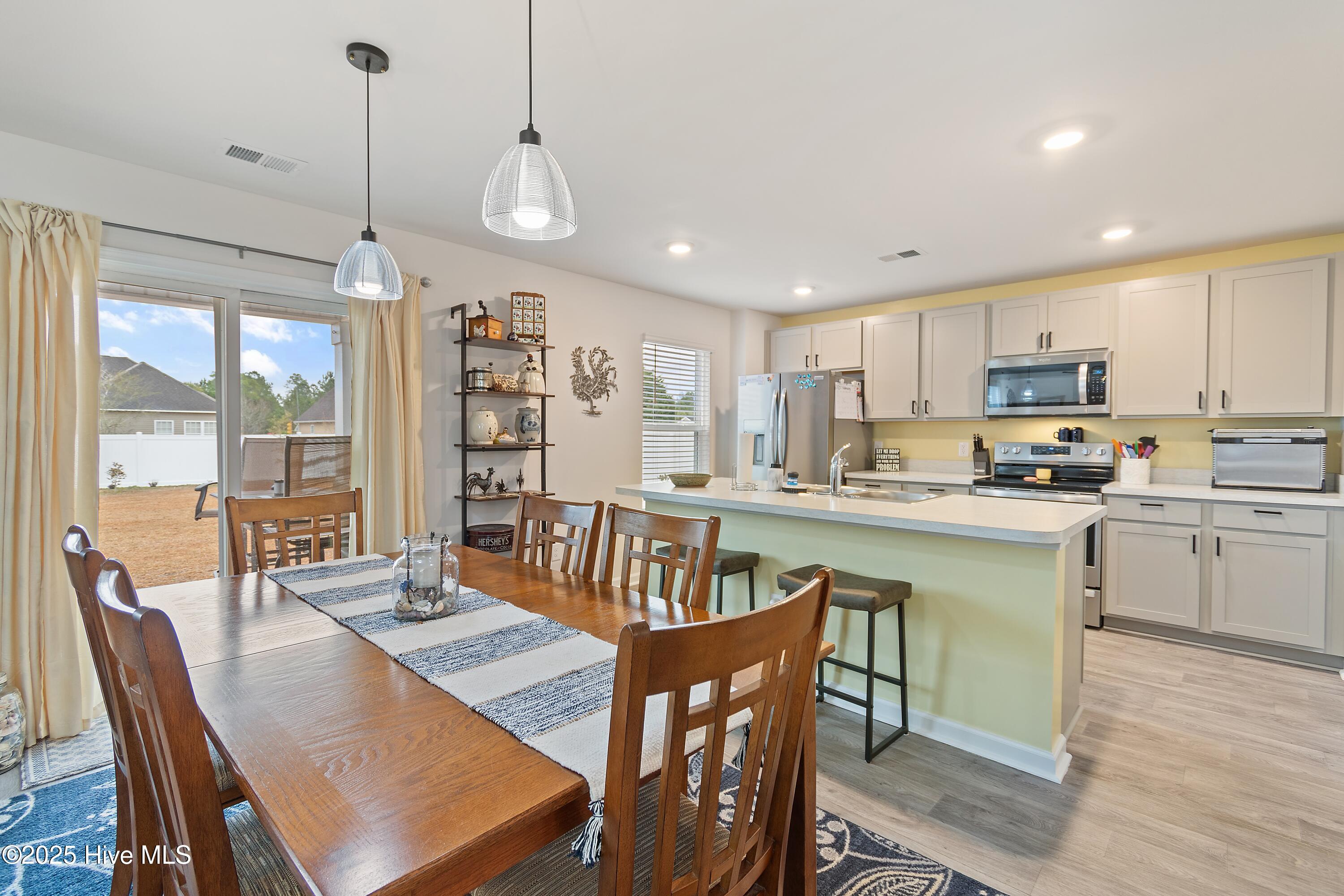 566 Pinecrest Street NW, Shallotte, NC 28470 – photo 15: Dining Area to Kitchen