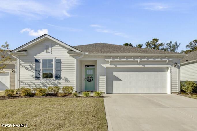 Hazel Branch at Brunswick Forest offers a well-rounded lifestyle with access to resort-style amenities, shopping, dining, and medical facilities, giving residents a comfortable blend of everyday convenience and coastal leisure. With 3 bedrooms, 2 bathrooms, and a 2-car garage, this home features a sensible open-concept layout designed for everyday comfort. Luxury vinyl plank flooring extends throughout the foyer, living room, dining room, and kitchen, creating a cohesive and modern feel. The kitchen is a standout with its large center island, granite countertops, pantry, and stainless steel appliances. A sliding glass door opens to a covered patio, and the back yard faces a natural setting that enhances privacy. Modern convenience is built right in. The home includes a smart video doorbell, smart thermostat, and a smart-hub touch screen interface—all connected to an app that allows you to monitor and manage key systems effortlessly. The split-bedroom floor plan places the primary suite on its own side of the home. This relaxing space includes a double-sink vanity, shower, and a large custom walk-in closet. Two guest bedrooms are located off the foyer, and ceiling fans are installed in every bedroom as well as the living room for added comfort. Living in Brunswick Forest means enjoying resort-style amenities, including miles of walking trails, fitness centers, indoor and outdoor pools, tennis and pickleball courts, and a kayak/canoe launch on Town Creek. The community also offers an active social calendar with clubs and gatherings throughout the year. Lawn maintenance is included in the Hazel Branch section, making this home an easy choice for those seeking both convenience and recreation.