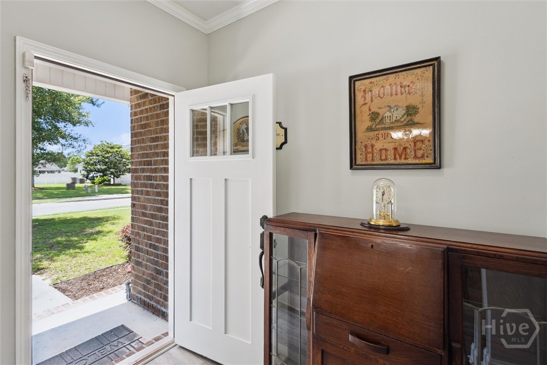 A spacious foyer welcomes you into this charming h