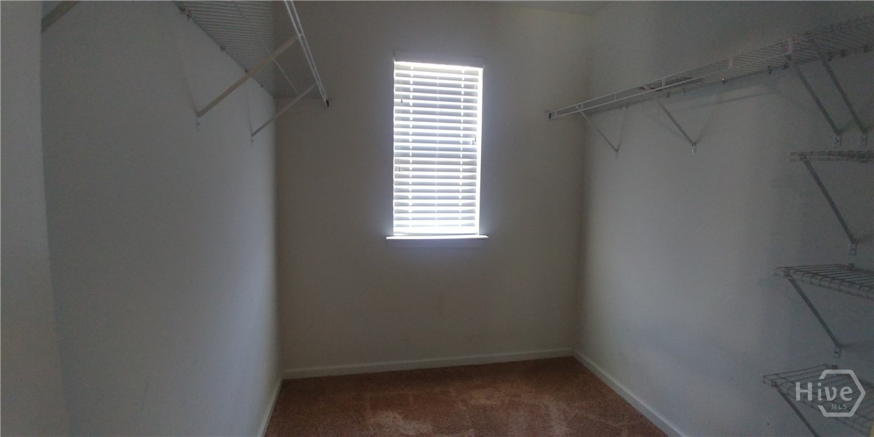 Huge walk-in closet in primary bedroom