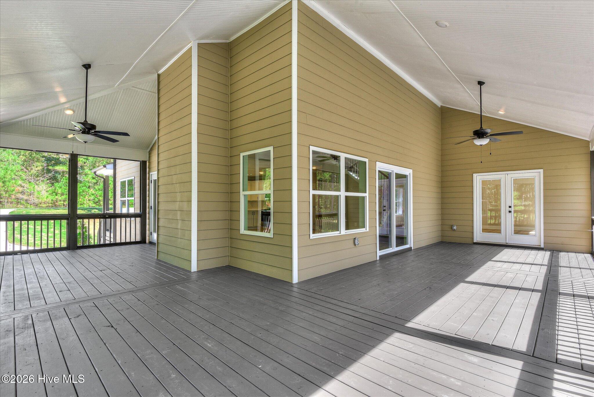 Rear screened porch stretches down the right side and across the back of the home.
