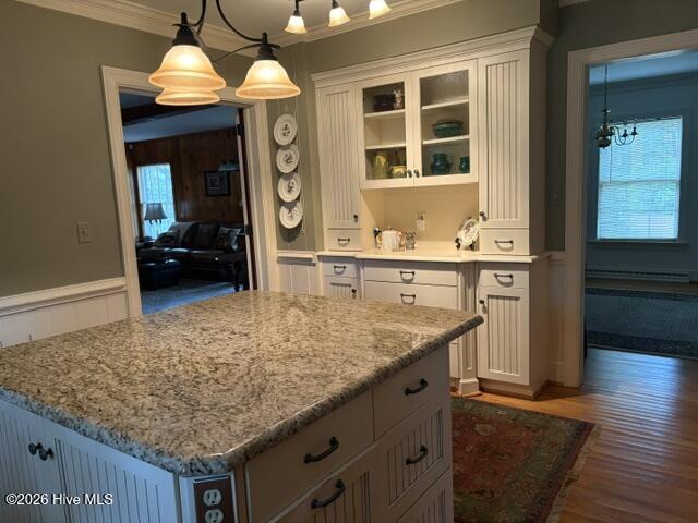 large granite topped kitchen island, beautiful built in with glass front display cabinet