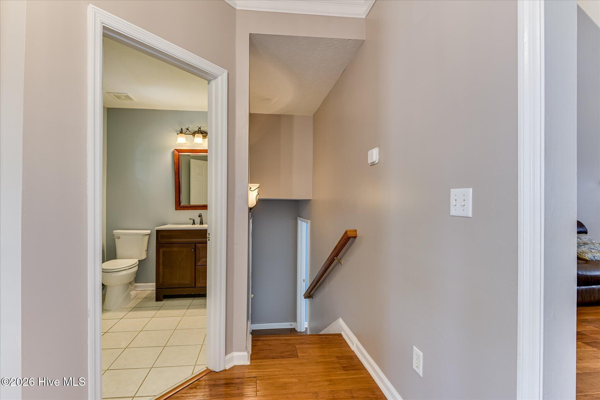 Stairs leading to guest suite and garage