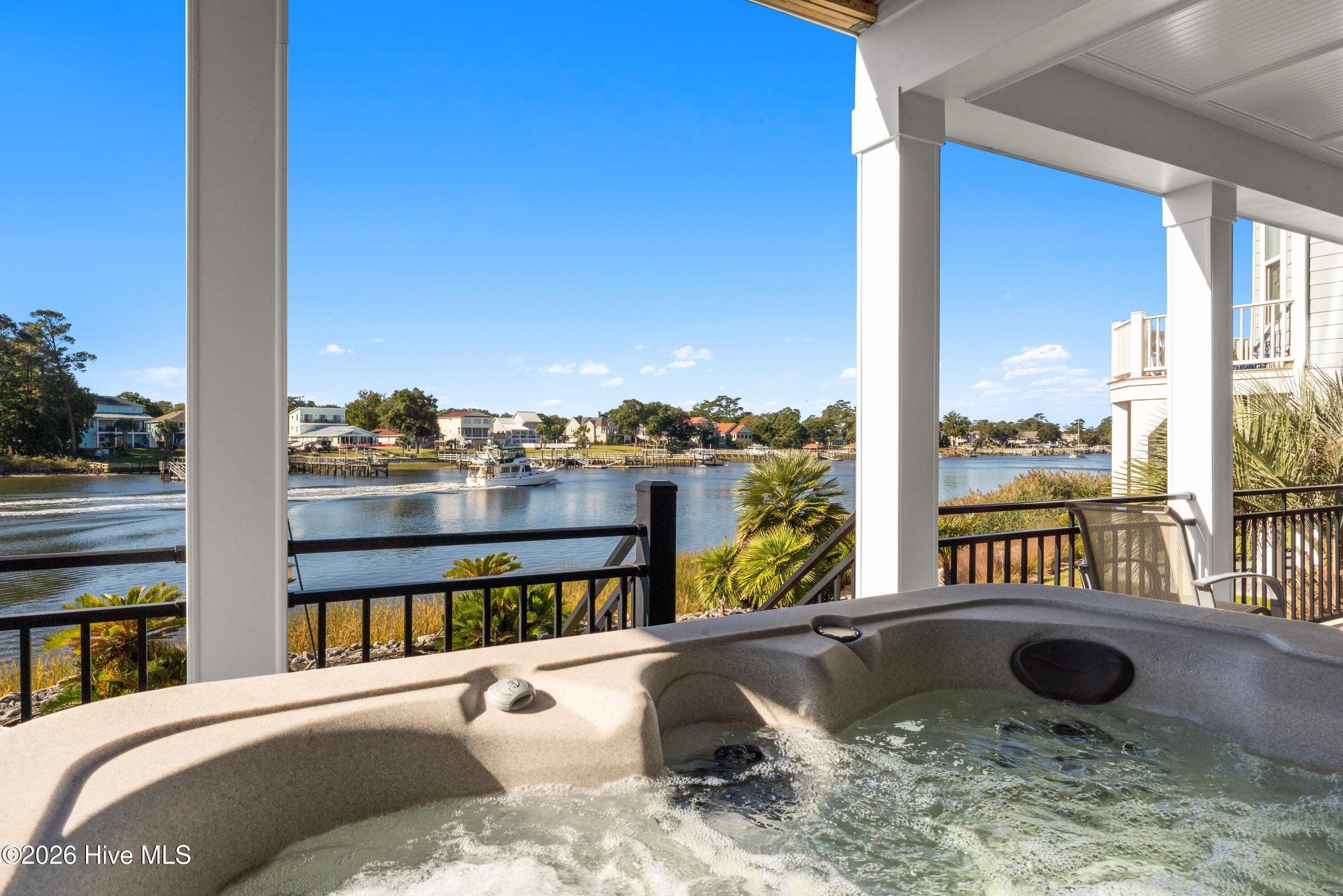 Sip your wine in the hot tub while watching the boats go by