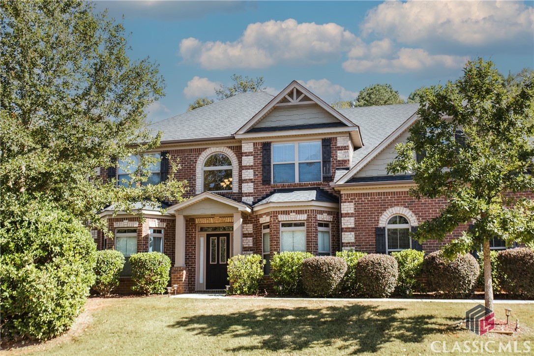 Welcome to 1938 Orchard Dr, nestled in the heart of sought-after Oconee County, within the Meadow Springs subdivision. This home offers a wonderful blend of spaciousness, style, and comfort, seamlessly marrying modern living with timeless elegance.Upon entering, the double-height foyer floods the space with natural light. To your left, you'll find an inviting office/flex space, and to the right, a dedicated dining room with gorgeous coffered ceiling.The kitchen strikes a perfect balance between functionality and charm, featuring granite countertops and a practical peninsula that encourages interactive moments with family and guests. The generously proportioned family room centers around a stunning stone fireplace, creating a cozy heart to the home.A comfortable-sized bedroom, complete with a full bathroom accessible from both the room and the hallway, adds incredible versatility to the main level layout.Upstairs, you'll discover an oversized main bedroom, providing ample space for a sitting area or private office, accompanied by a luxuriously appointed en-suite bathroom that redefines luxury and space. Four additional spacious bedrooms and a conveniently located laundry room complete this level.Step outside to find an expansive, level fenced backyard. Whether you're envisioning al fresco dining, gardening, or play, this space promises endless opportunities for relaxation and enjoyment.Located in a wonderful pool and tennis community, this home is in move-in ready condition and waiting for someone to make it their home. Zoned for award-winning Oconee County Schools.