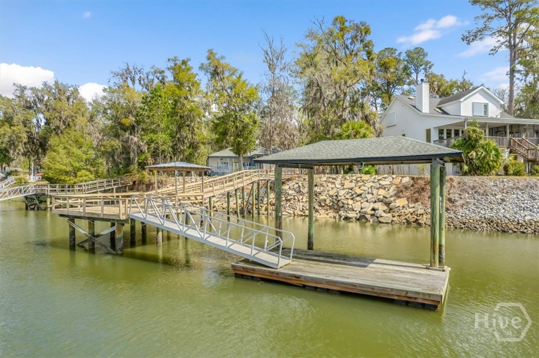Private Dock, floating dock and covered boat hoist.