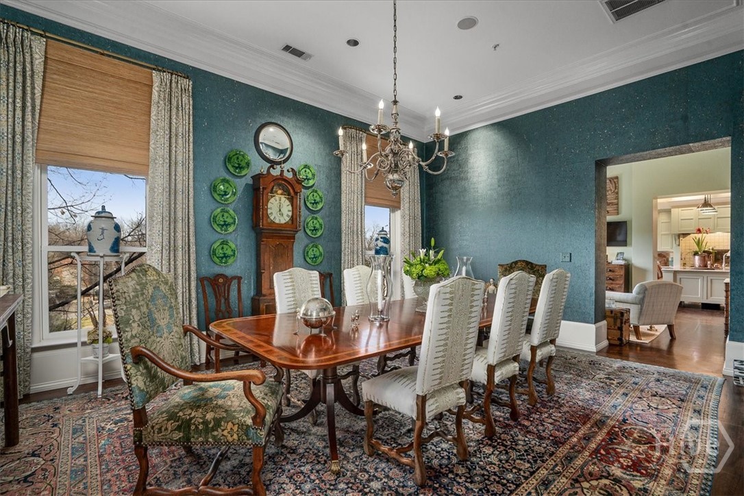 Stunning oversized Dining Room with Custom window treatments and Designer wall paper