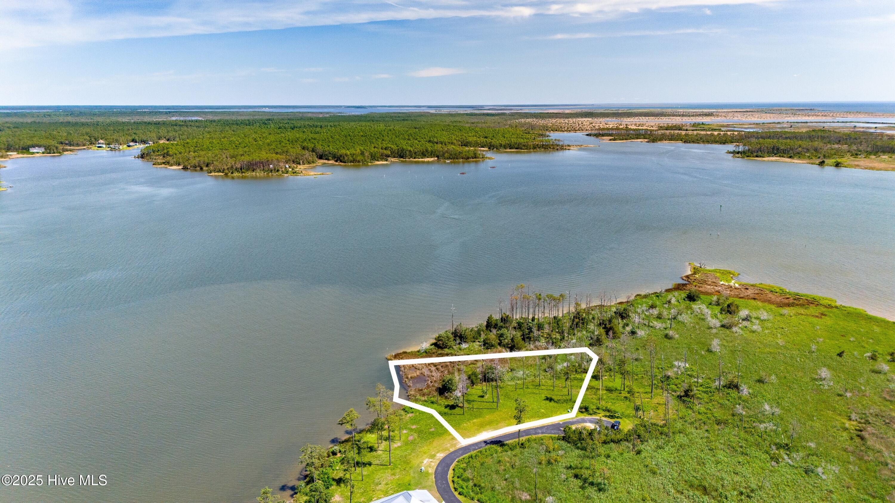 489 Ballast Point Oriental, North Carolina Live the Coastal Dream in River Dunes - A Boater's Paradise.
Discover an extraordinary opportunity to own waterfront property at an exceptional value in River Dunes, one of the most exclusive and highly sought-after waterfront communities on the East Coast. This is more than a homesite ''it's an invitation to embrace the coastal lifestyle you've always dreamed of. River Dunes is celebrated for its award-winning master plan, which blends timeless architecture, inviting gathering spaces, and panoramic water views with a deep appreciation for outdoor living. This is a community where every detail is designed with boaters and coastal enthusiasts in mind. At the heart of River Dunes is its world-class, 28-acre inland basin marina ''recognized as one of the finest on the Intracoastal Waterway. With over 400 deep-water slips for sailboats and powerboats, floating docks, a protected harbor, and direct access to the ICW, Broad Creek, and the Neuse River, it offers year-round boating in a naturally sheltered setting. Located just up the coast from Oriental, North Carolina ''fondly known as the 'Sailing Capital of North Carolina'', River Dunes offers a rare blend of tranquility, luxury, and access to open water adventure. Whether you're setting sail for a weekend cruise or enjoying an evening on the dock, life here moves with the rhythm of the tide. Waterfront opportunities at this price point in such a premier coastal community are few and far between. Don't miss your chance to secure a place in River Dunes, where everyday life feels like a vacation, and the water is always just steps away.