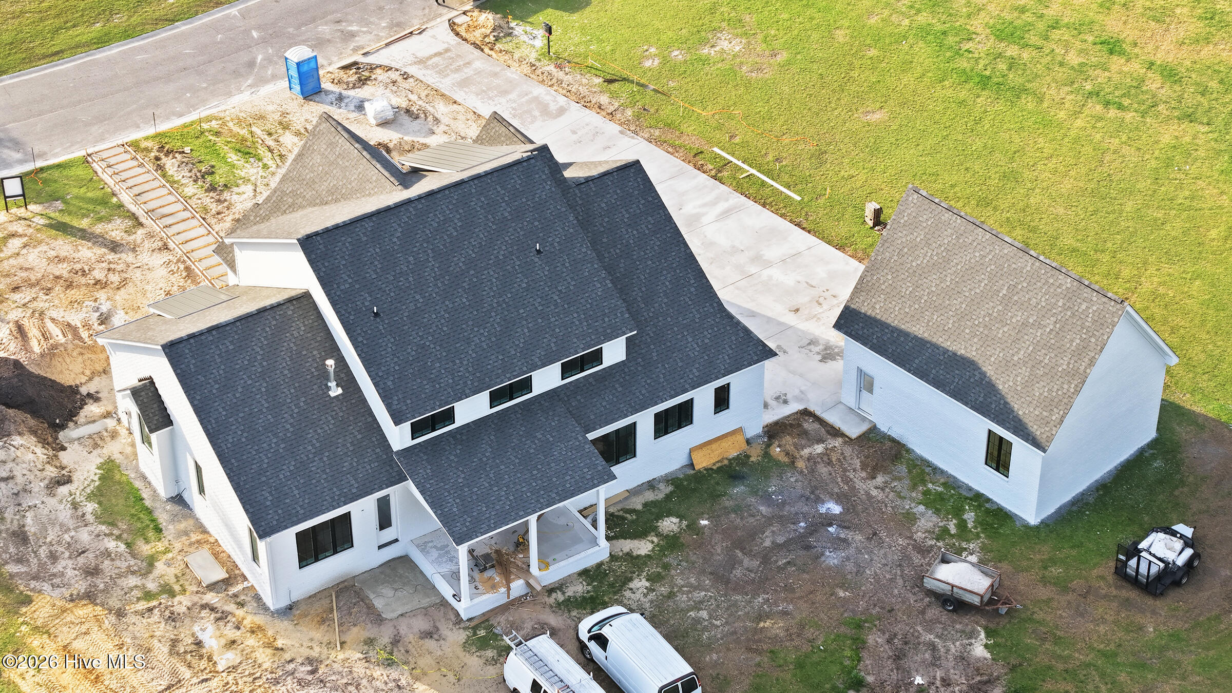 covered back porch, 4 car garage spaces