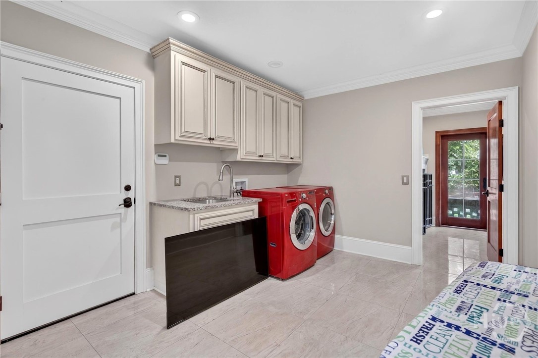 Laundry room, indoor kennel on the right, garages through door on left.